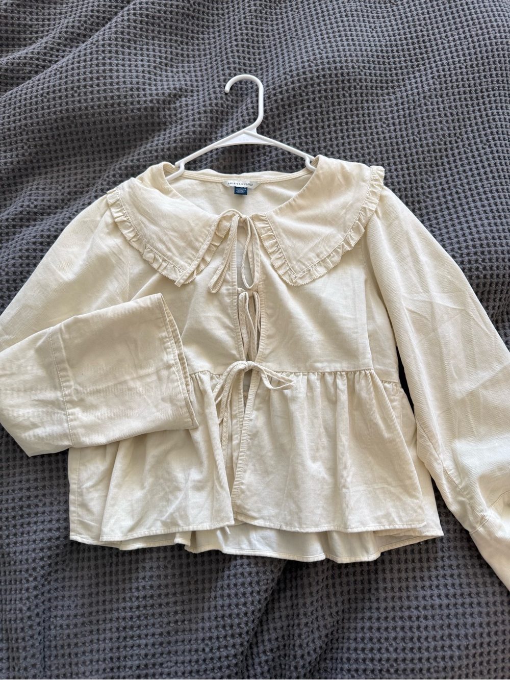 Cream Peplum Tie-Front Blouse with Ruffled Collar